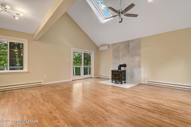 unfurnished living room with a wall unit AC, wood finished floors, and a baseboard radiator