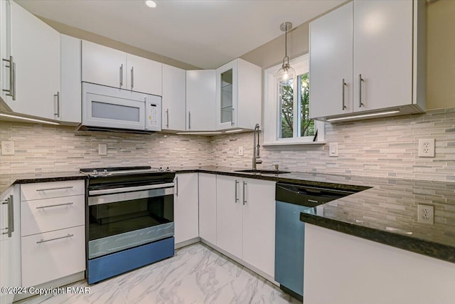 kitchen featuring marble finish floor, stainless steel electric range oven, white microwave, a sink, and dishwashing machine