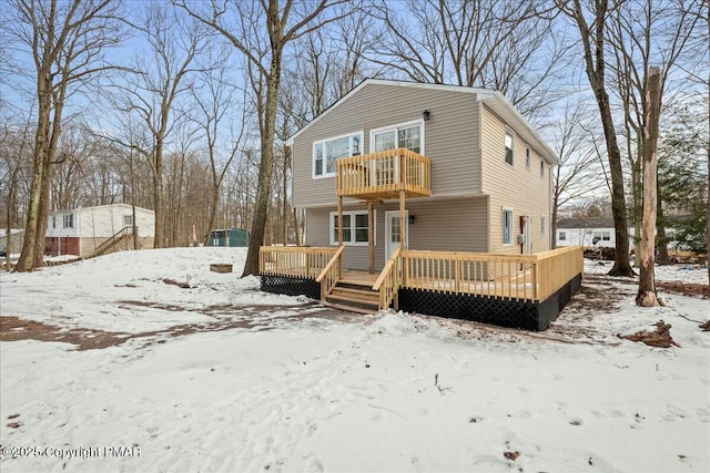 view of front of home featuring a balcony and a deck