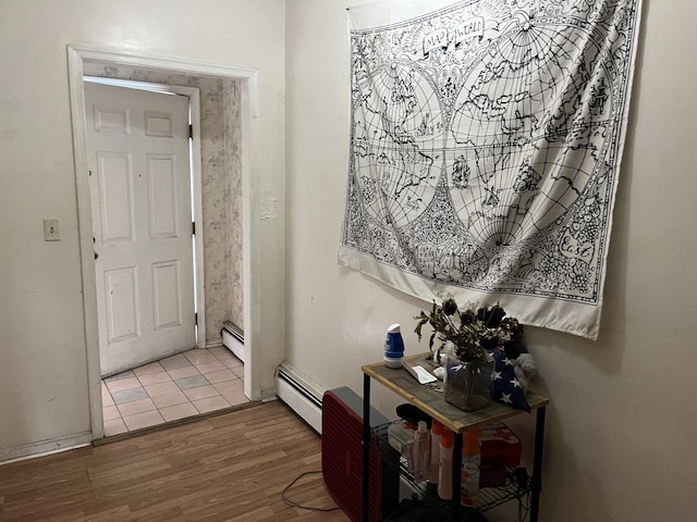 507 Thomas St, Stroudsburg, PA 18360 - foyer with a baseboard heating unit, wood finished floors, and baseboards
