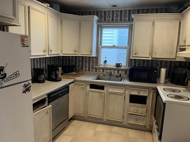 507 Thomas St, Stroudsburg, PA 18360 - kitchen featuring freestanding refrigerator, black microwave, dishwasher, a sink, and electric range