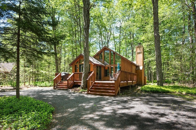 2107 Oak Rd, Pocono Pines, PA 18350 - rustic home with a chimney and a wooden deck