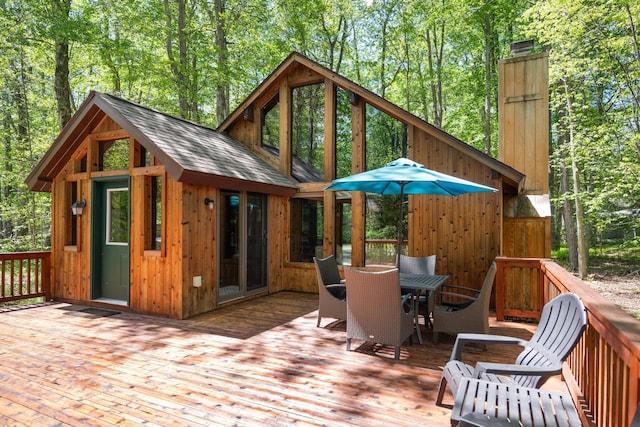 2107 Oak Rd, Pocono Pines, PA 18350 - wooden terrace featuring outdoor dining space and an outbuilding
