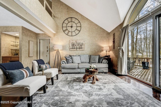 living room with high vaulted ceiling