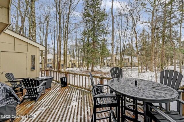 view of snow covered deck