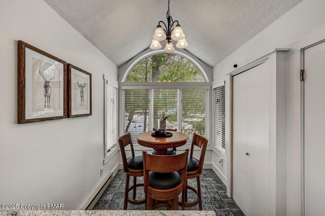 dining room with lofted ceiling, a baseboard radiator, a textured ceiling, and an inviting chandelier