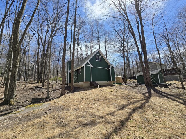 176 Fawn Rd, Pocono Lake, PA 18347 - view of home's exterior featuring an outdoor structure and a storage unit