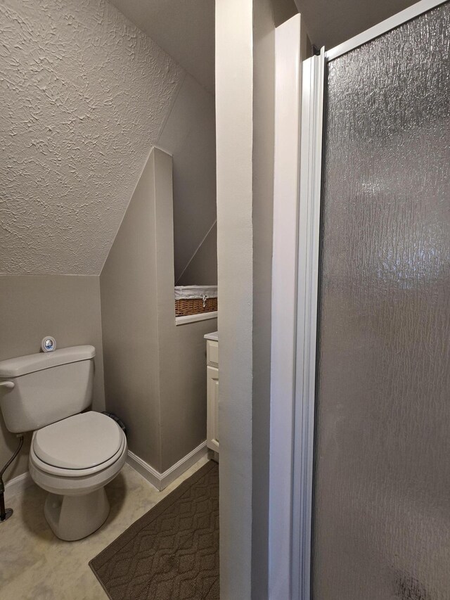 176 Fawn Rd, Pocono Lake, PA 18347 - full bath featuring a textured ceiling, toilet, baseboards, and a stall shower
