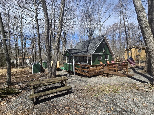 176 Fawn Rd, Pocono Lake, PA 18347 - rear view of house featuring a deck and a shingled roof