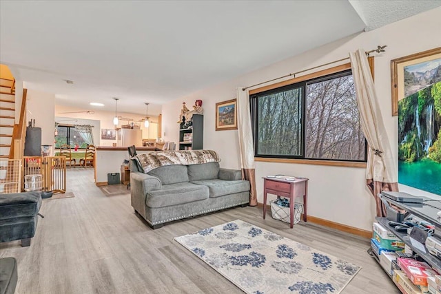 232 Image Dr, Scotrun, PA 18355 - living room featuring baseboards, stairs, and wood finished floors