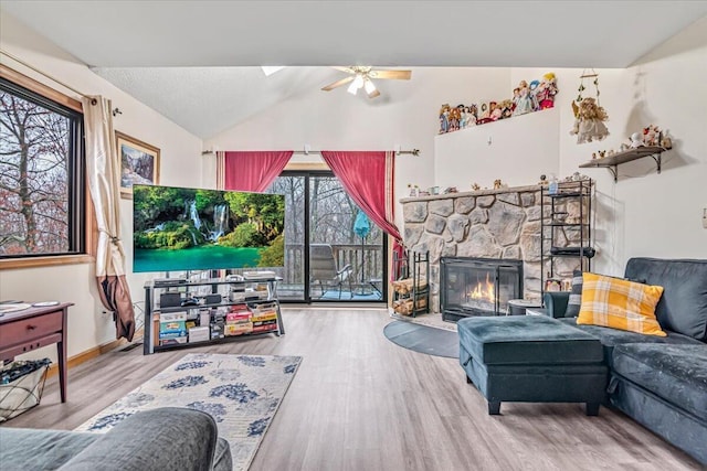 232 Image Dr, Scotrun, PA 18355 - living area with lofted ceiling, wood finished floors, a fireplace, baseboards, and a ceiling fan