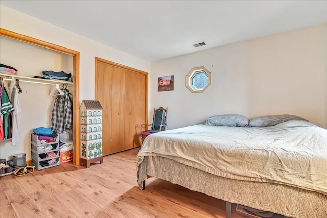 232 Image Dr, Scotrun, PA 18355 - bedroom featuring two closets, wood finished floors, and visible vents