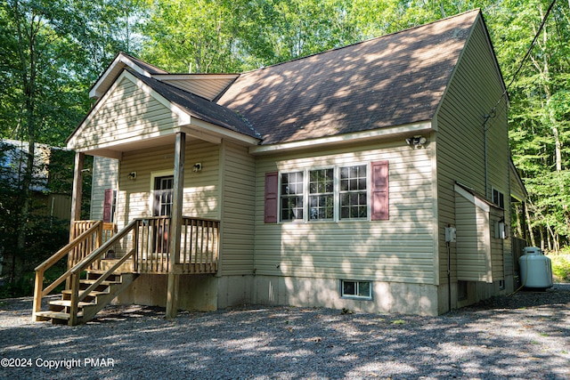 view of front of property with roof with shingles