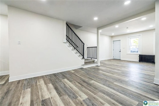 242 E Hazard St, Summit Hill, PA 18250 - foyer entrance with radiator, stairs, wood finished floors, recessed lighting, and baseboards