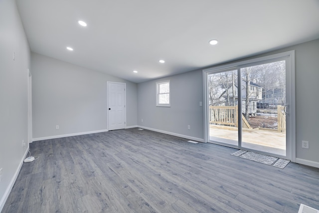 8263 Natures Dr, Tobyhanna, PA 18466 - empty room featuring wood finished floors, baseboards, recessed lighting, and lofted ceiling