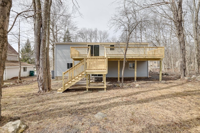 back of property with stairs and a wooden deck