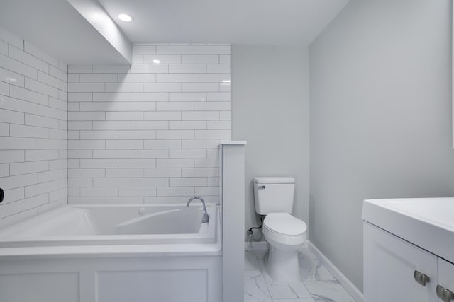 full bathroom featuring baseboards, toilet, a bath, marble finish floor, and vanity