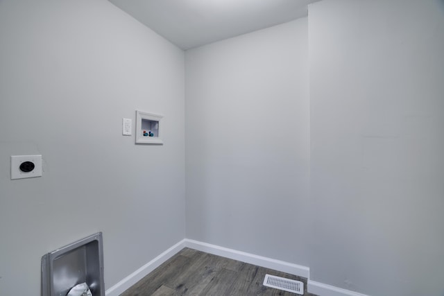 washroom featuring visible vents, baseboards, hookup for an electric dryer, hookup for a washing machine, and laundry area