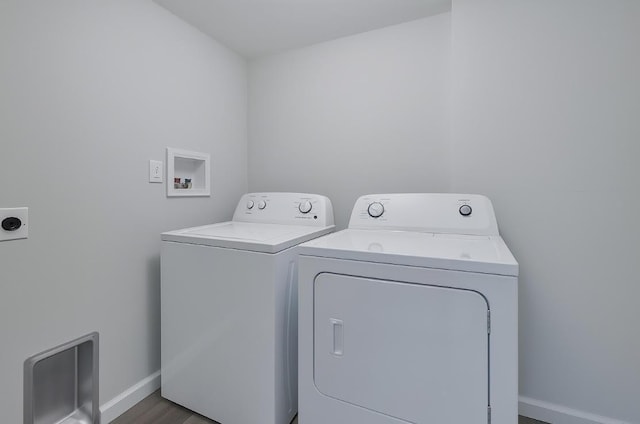 8263 Natures Dr, Tobyhanna, PA 18466 - washroom with baseboards, separate washer and dryer, and wood finished floors