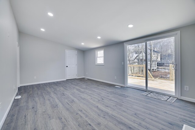 8263 Natures Dr, Tobyhanna, PA 18466 - empty room featuring wood finished floors, baseboards, recessed lighting, and lofted ceiling