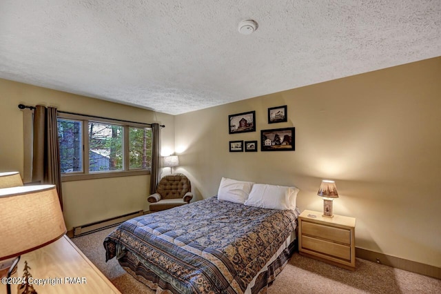 carpeted bedroom featuring a textured ceiling, a baseboard radiator, and baseboards