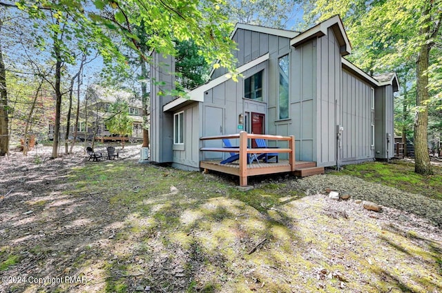 rear view of house with board and batten siding