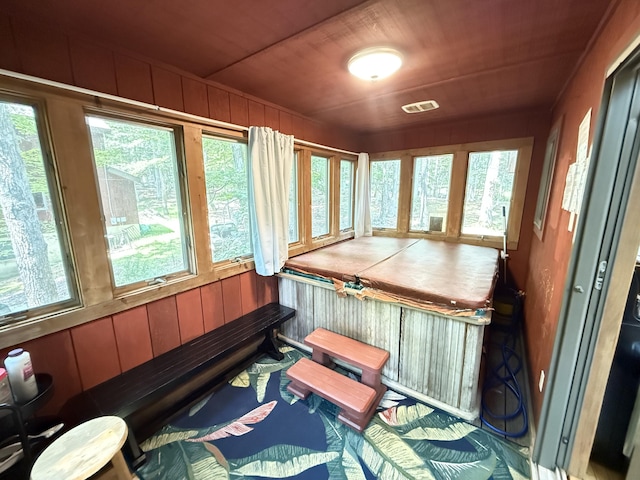 6414 Decker Rd, Bushkill, PA 18324 - sunroom / solarium with plenty of natural light, wood walls, and wooden ceiling