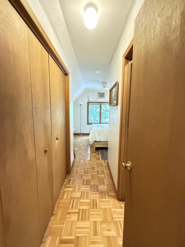6414 Decker Rd, Bushkill, PA 18324 - corridor with a textured ceiling and vaulted ceiling