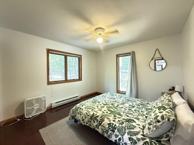 6414 Decker Rd, Bushkill, PA 18324 - bedroom featuring a baseboard radiator, wood finished floors, and a ceiling fan