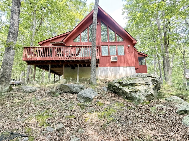 6414 Decker Rd, Bushkill, PA 18324 - rear view of property featuring a deck, a wooded view, and a wall unit AC