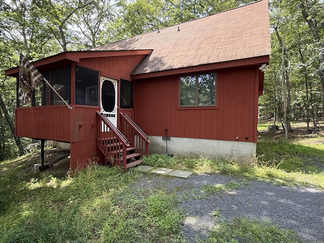 6414 Decker Rd, Bushkill, PA 18324 - chalet / cabin with a sunroom and a shingled roof