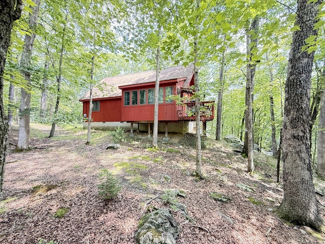6414 Decker Rd, Bushkill, PA 18324 - back of property with crawl space, a deck, and roof with shingles