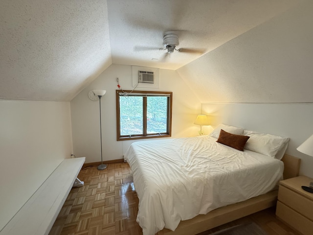 6414 Decker Rd, Bushkill, PA 18324 - bedroom with a textured ceiling, vaulted ceiling, a ceiling fan, and a wall unit AC