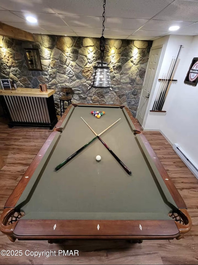 rec room with pool table, wood finished floors, and a baseboard radiator