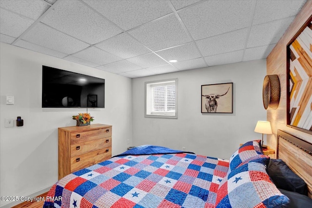 bedroom with a paneled ceiling