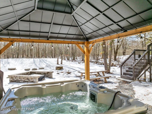 exterior space featuring a gazebo and a hot tub