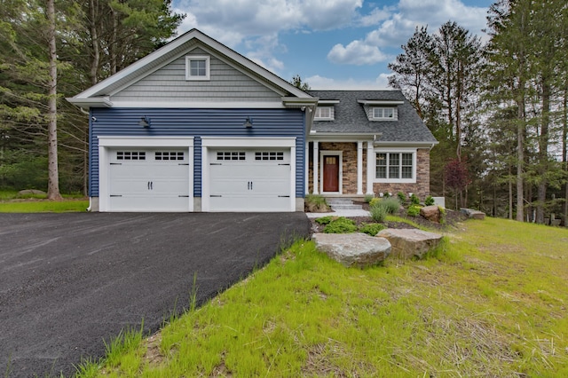 210 Canterbury Cir, Blakeslee, PA 18610 - view of front facade featuring roof with shingles, stone siding, and aphalt driveway