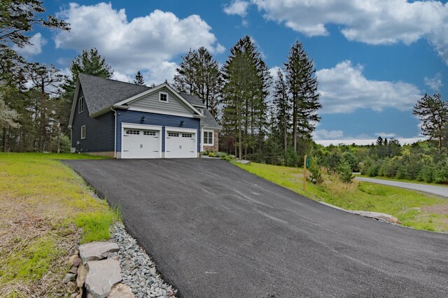 210 Canterbury Cir, Blakeslee, PA 18610 - exterior space featuring a garage, driveway, and a lawn