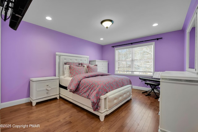 bedroom with recessed lighting, baseboards, and hardwood / wood-style flooring