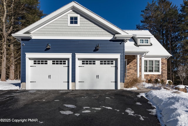 view of front of home featuring a garage and driveway