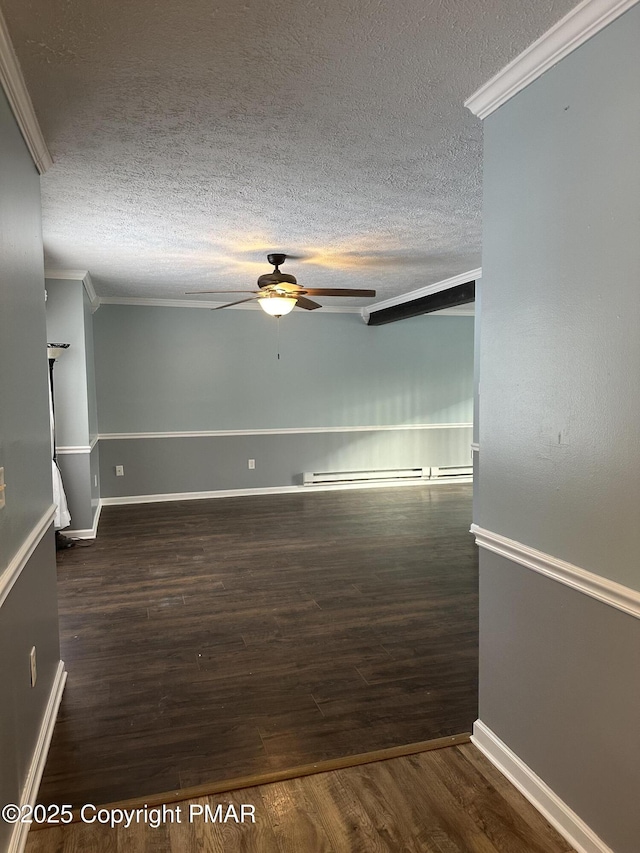 spare room with ornamental molding, dark wood-type flooring, a textured ceiling, and ceiling fan