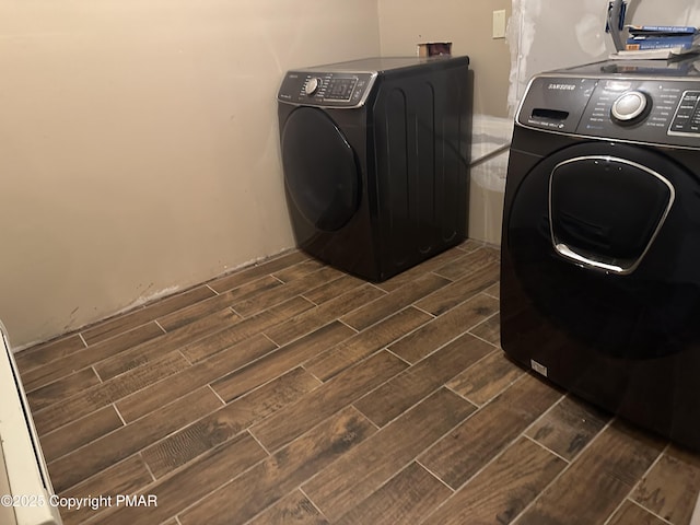 clothes washing area featuring independent washer and dryer