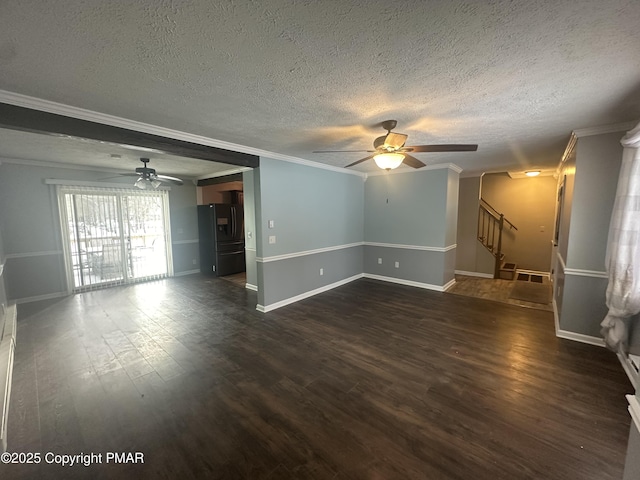 unfurnished living room with ornamental molding, dark wood-type flooring, a textured ceiling, and ceiling fan