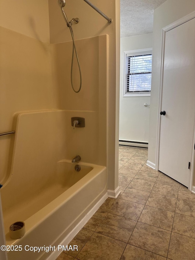 bathroom with bathtub / shower combination, tile patterned flooring, a textured ceiling, and a baseboard heating unit