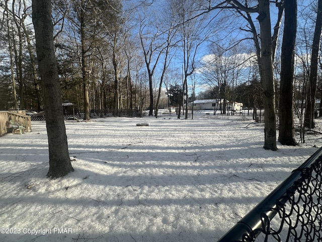 view of yard layered in snow