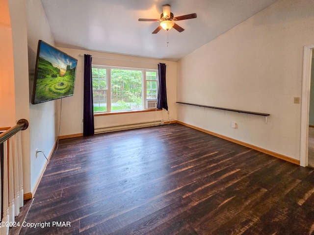 empty room featuring baseboards, vaulted ceiling, baseboard heating, and wood finished floors