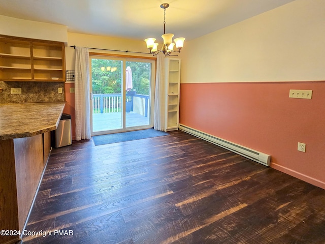 unfurnished dining area with dark wood-type flooring, baseboards, baseboard heating, and an inviting chandelier