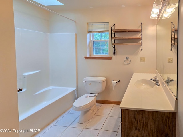 full bathroom featuring bathtub / shower combination, toilet, vanity, baseboards, and tile patterned floors