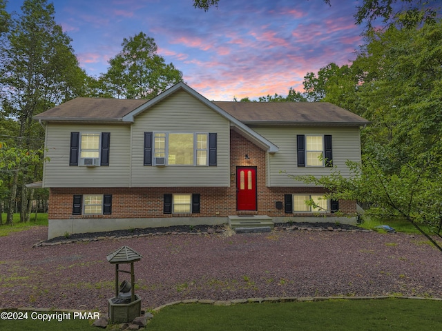 split foyer home with brick siding