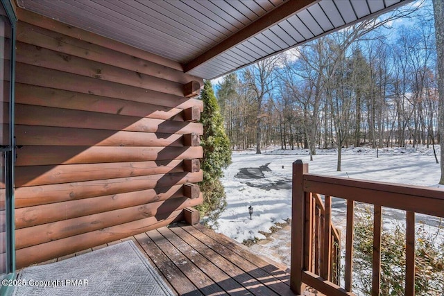 view of snow covered deck